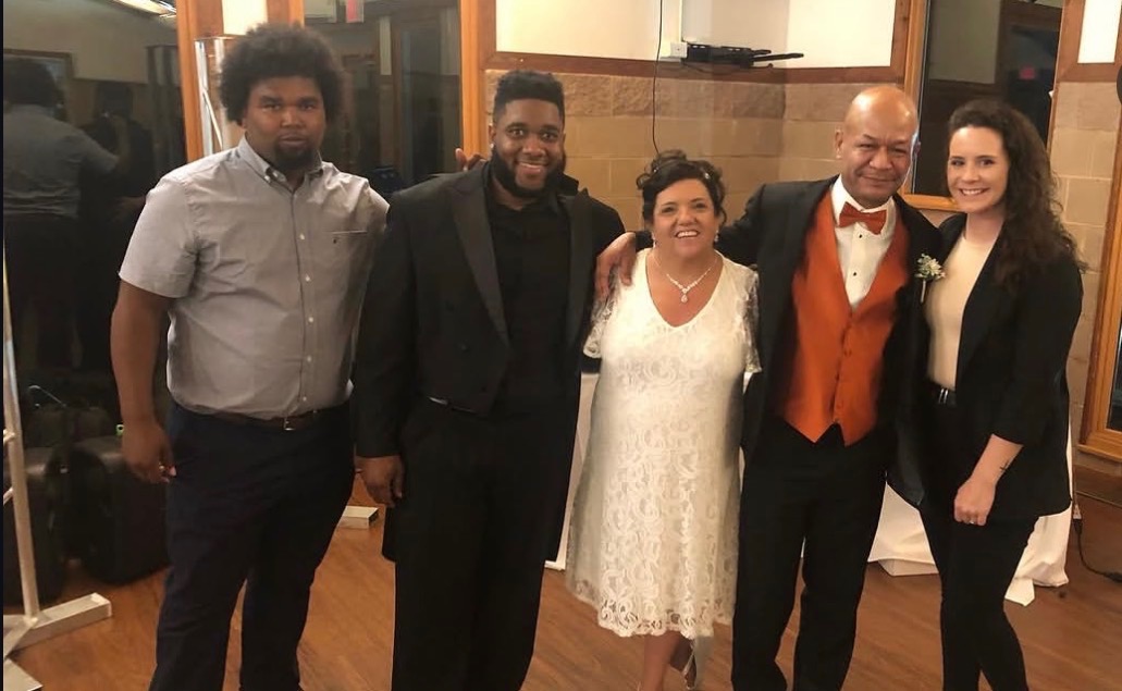 NBT Entertainment team with the bride and groom at a wedding reception