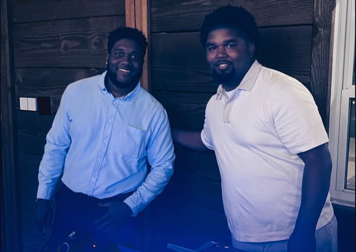 NBT Entertainment DJs behind the booth at an evening event