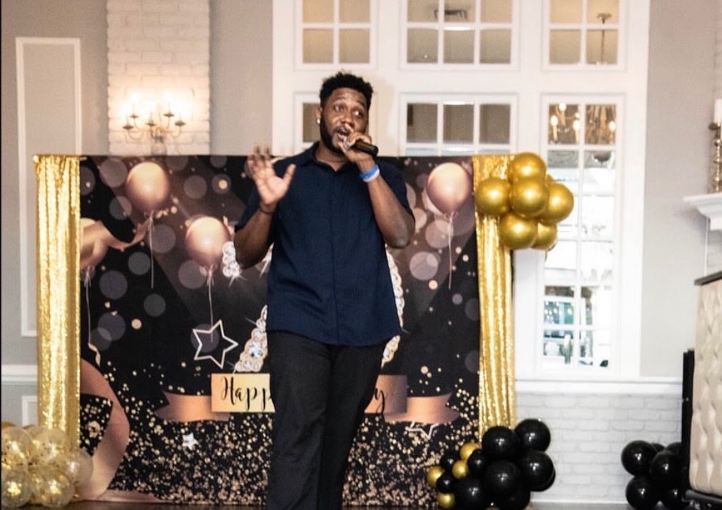 NBT Entertainment MC hosting a birthday celebration with balloon decor
