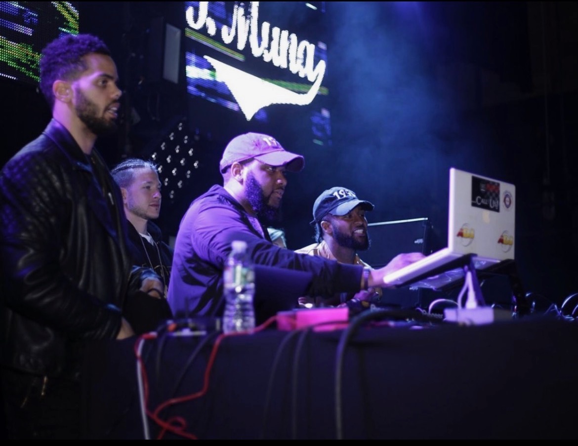 NBT Entertainment DJ crew performing live on stage with concert lighting
