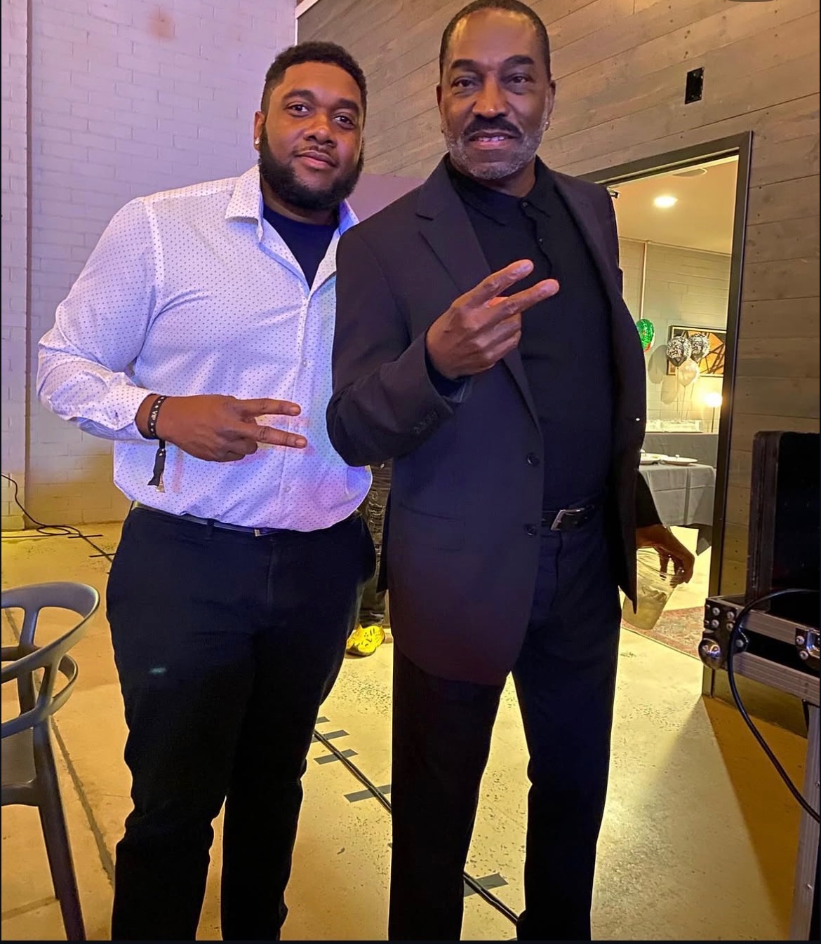 NBT Entertainment host posing with a guest at an evening celebration