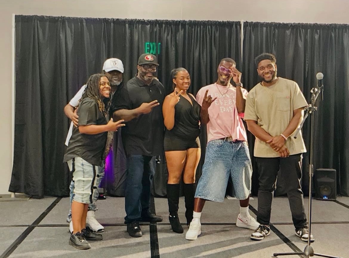 NBT Entertainment group photo with performers and guests backstage