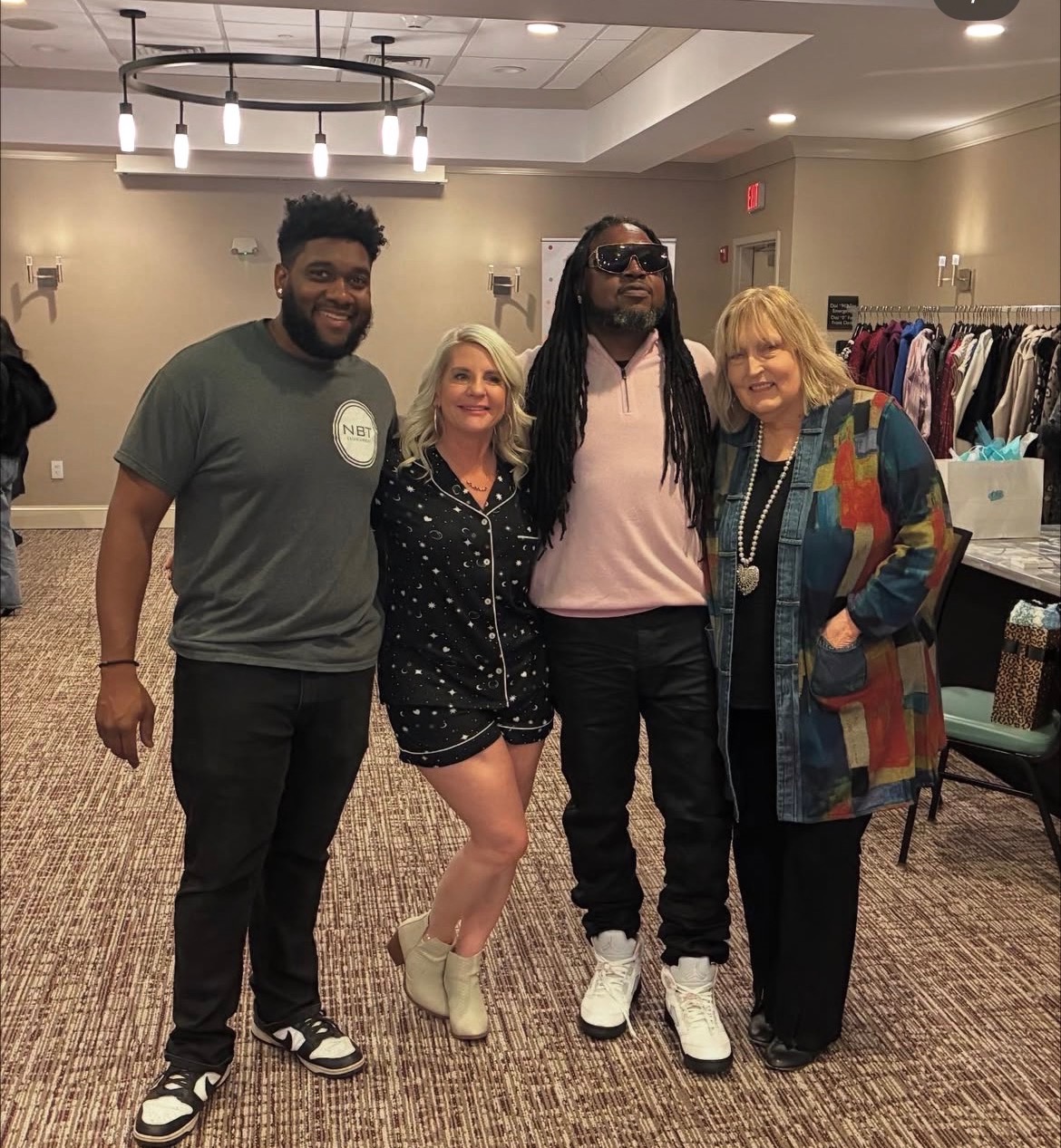 NBT Entertainment team posing with clients after a successful event