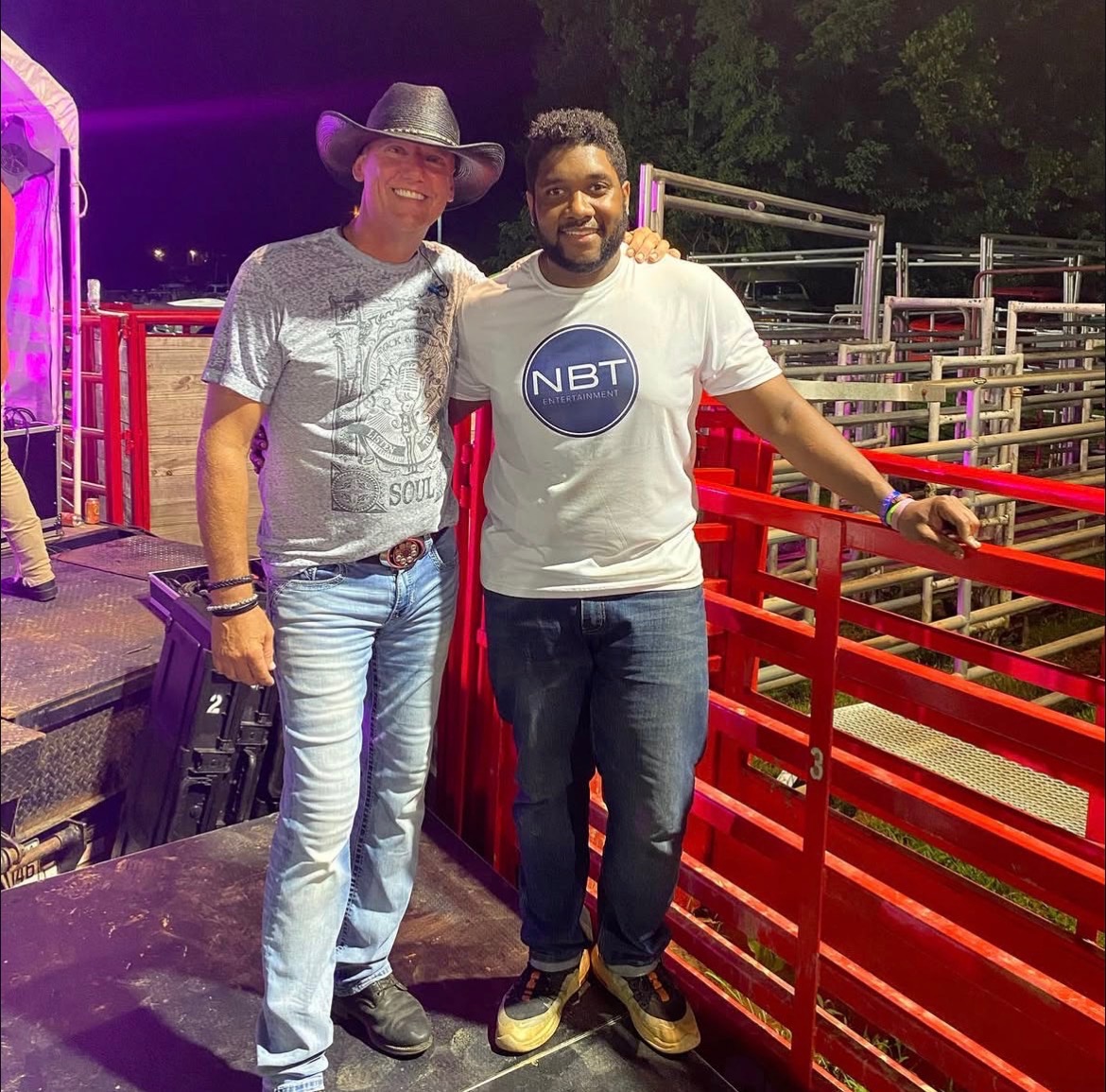 NBT Entertainment host with a country music artist at an outdoor concert